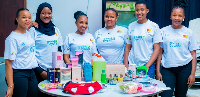 Group of women standing behind products on display